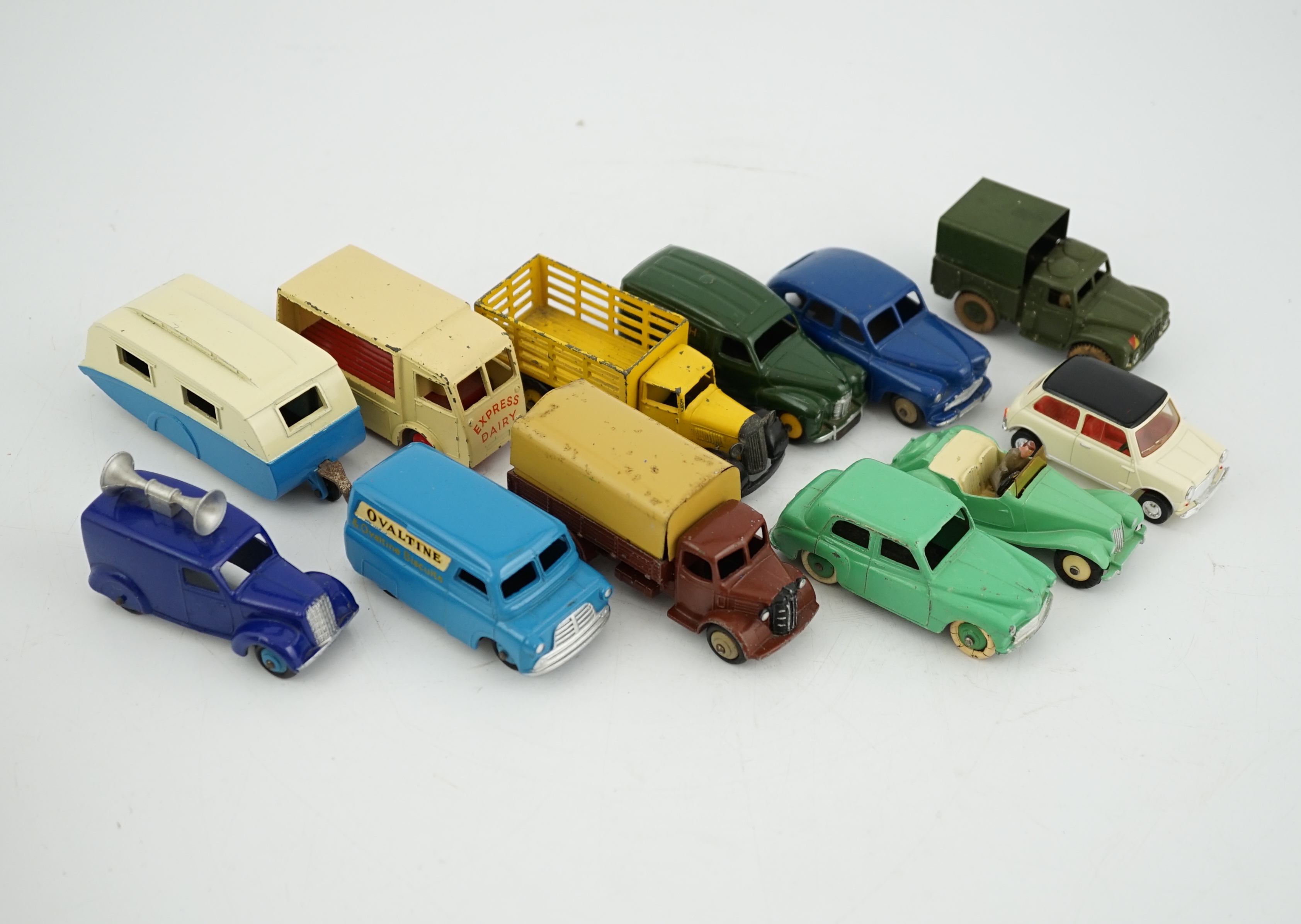 Twelve Dinky Toys, including; Austin van, Vanguard, Market Gardener’s wagon, Hillman Minx, MG Midget, Bedford van, etc.